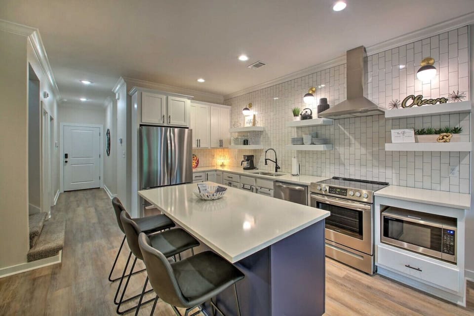 Cook up your favorite meals in a fully stocked, modern kitchen with sleek finishes