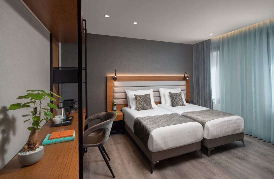 Deluxe Atrium Double or Twin Room | Minibar, in-room safe, desk, laptop workspace