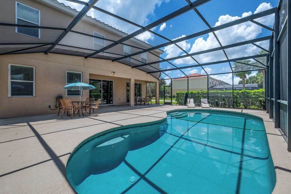 Private screened in patio and swimming pool
