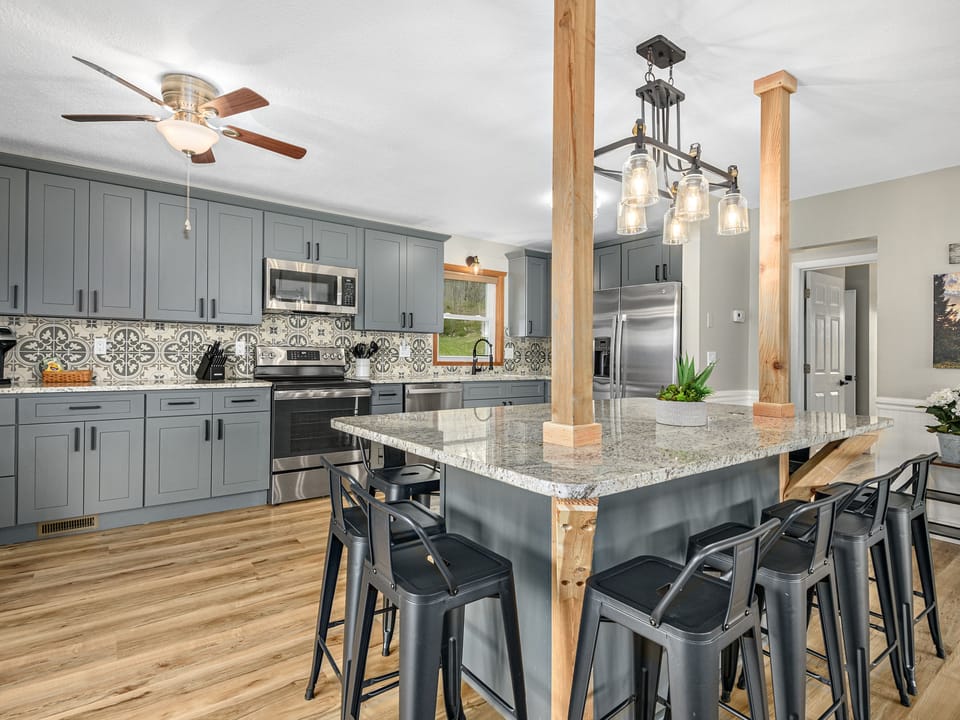 Modern updated kitchen with built-in table.