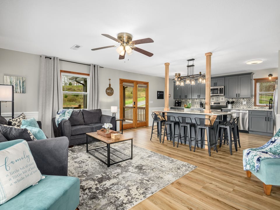 Experience modern comfort & style in  living room & fully equipped kitchen 