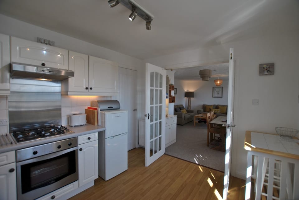The kitchen opens up to the dining area and lounge