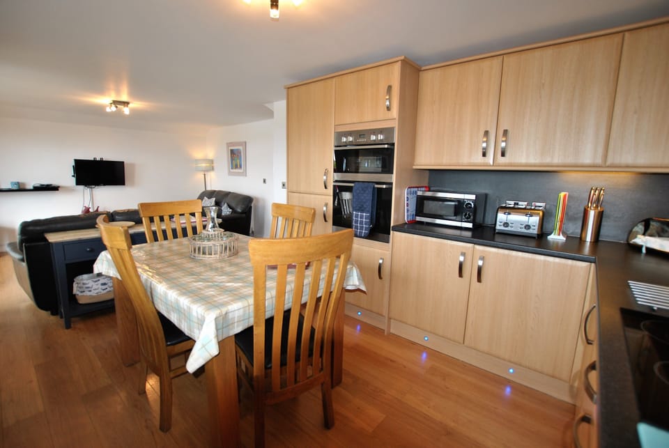 The kitchen is modern and well equipped