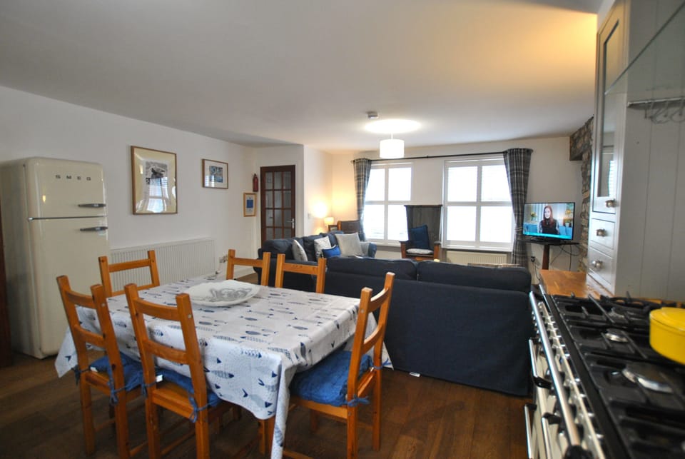Cook, chat and linger together – an airy open-plan kitchen, dining and lounge made for slow mornings and cosy nights