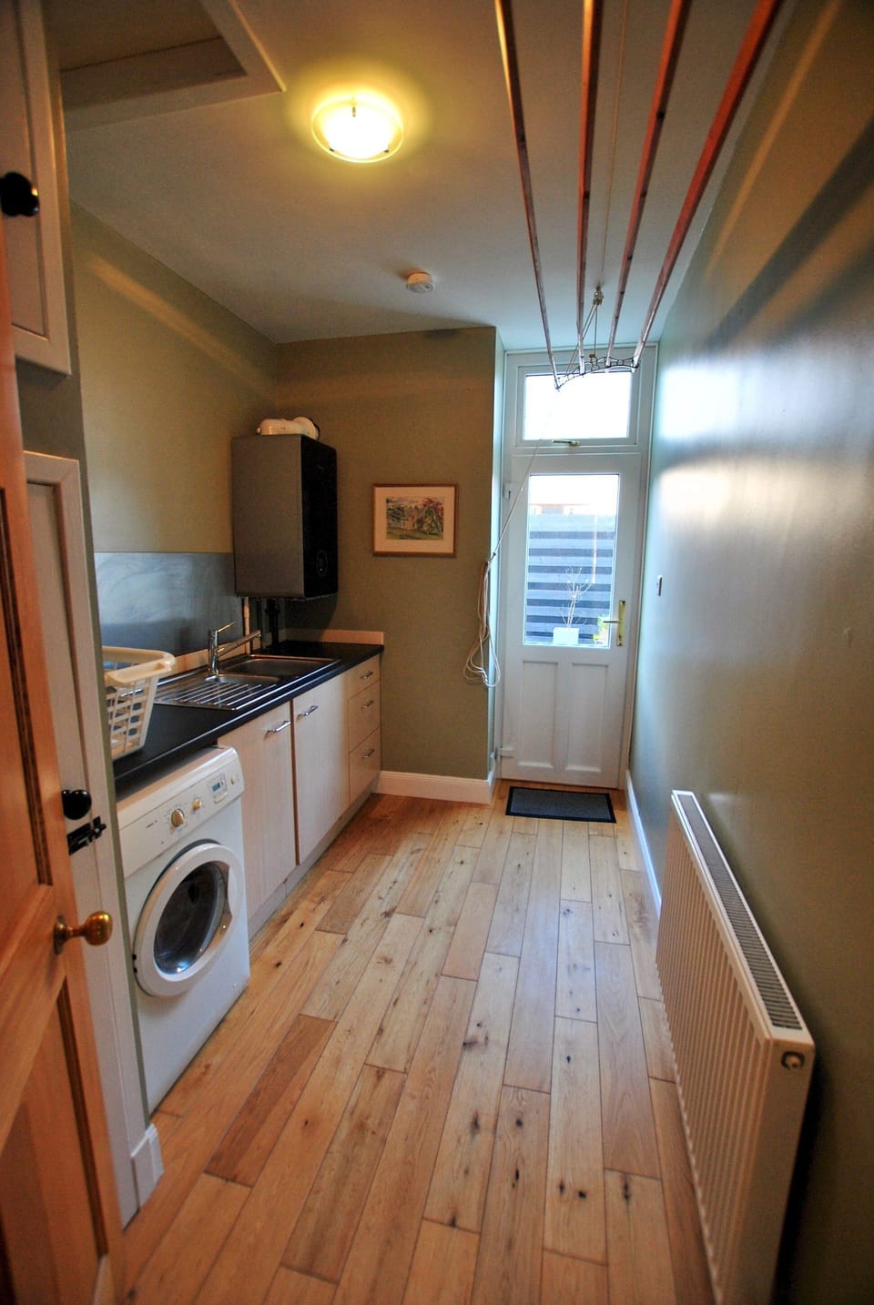 The utility room gives extra space as well as access to the rear courtyard