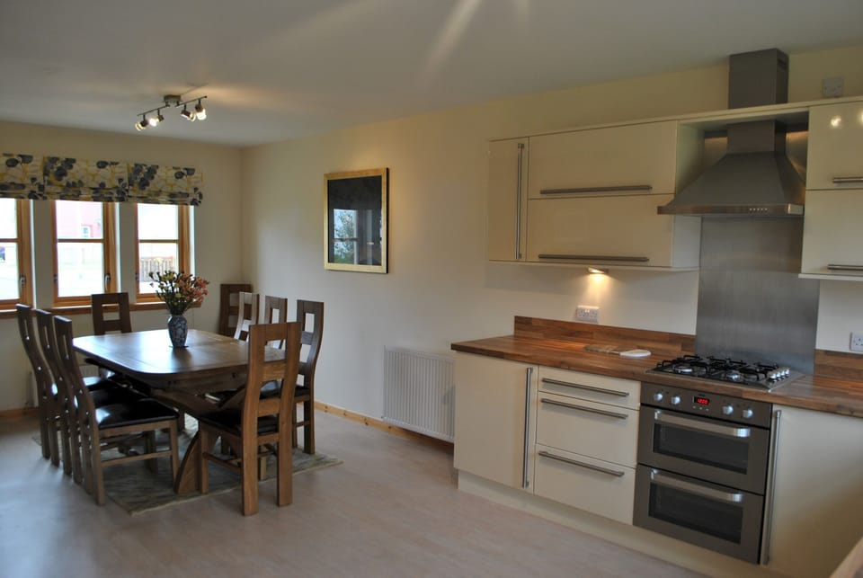 The open plan kitchen and dining area are great for gathering and spending time together