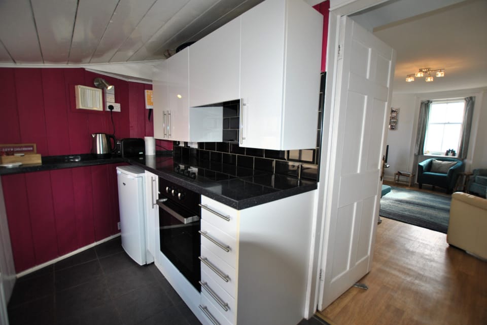 The compact kitchen is well-equipped