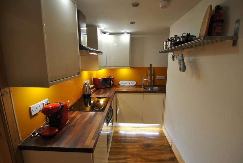 The kitchen is centrally positioned in the apartment