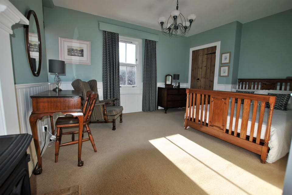 The light master bedroom has a king size bed