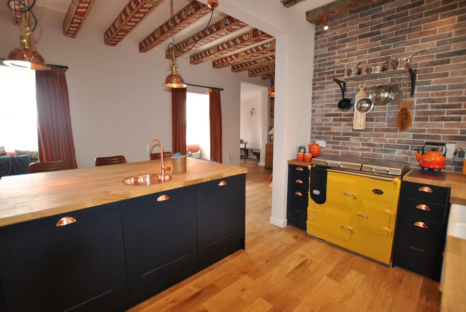 The feature Aga is the focal point of the kitchen