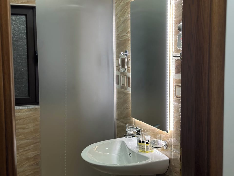 Family Room, Balcony | Bathroom | Shower, rainfall showerhead, free toiletries, hair dryer