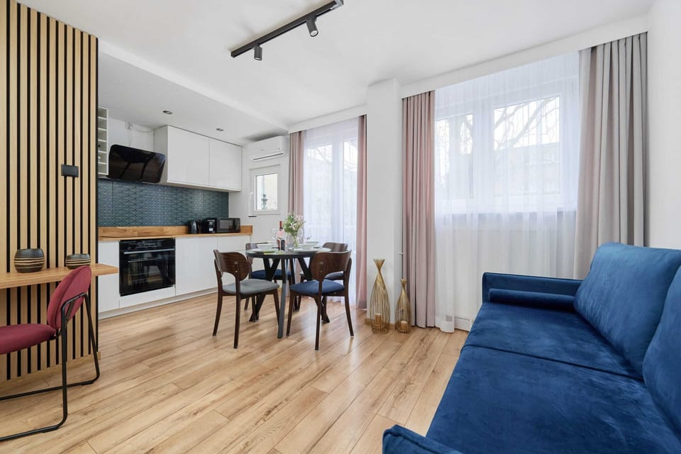 Another view of the open-plan layout, blending the kitchen, dining, and living areas seamlessly.
