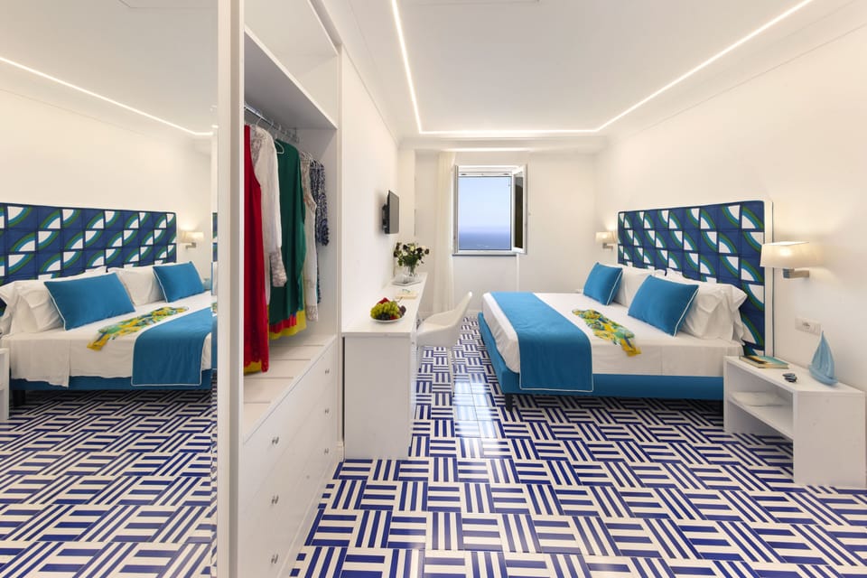 Premium Quadruple Room, Sea View | Minibar, in-room safe, individually decorated, individually furnished
