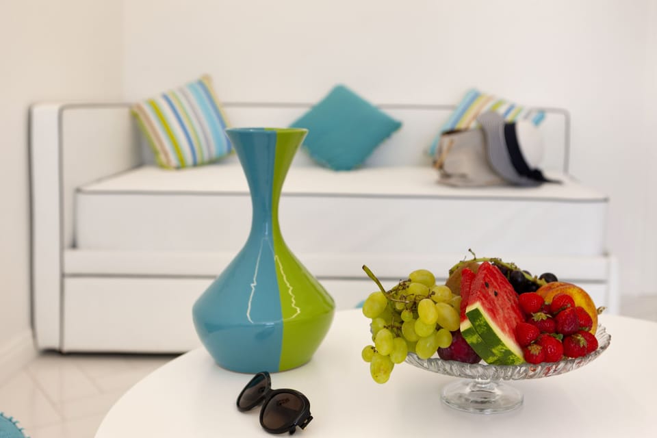 Royal Quadruple Room, Sea View | Minibar, in-room safe, desk, laptop workspace