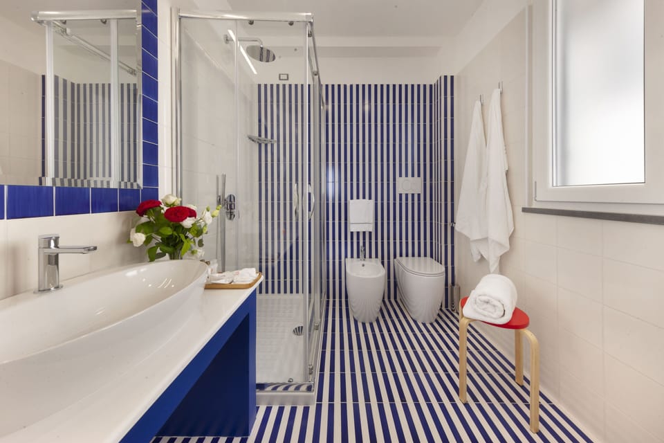 Exclusive Room, Sea View | Bathroom | Shower, rainfall showerhead, hair dryer, bathrobes