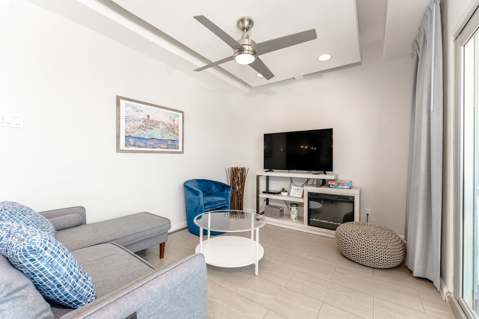 Our beachy living area is the perfect backdrop for your next vacation.