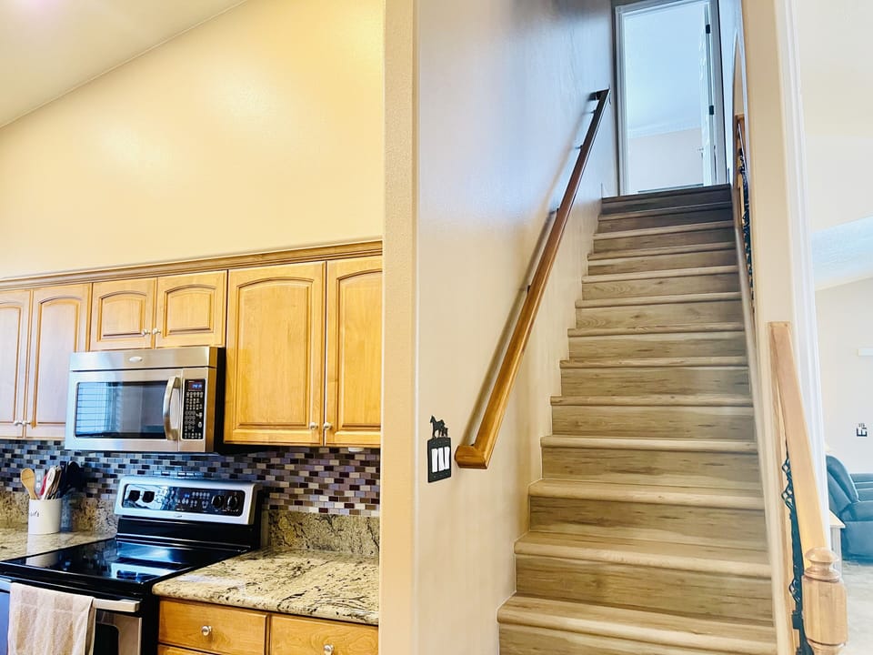 Stairs up to Primary Suite