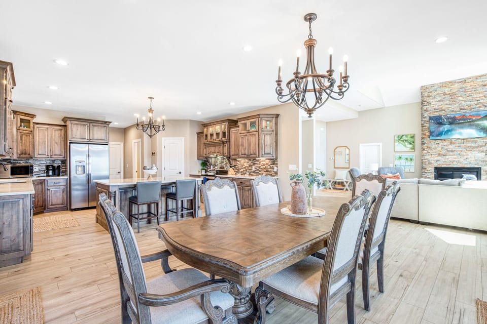 Open living and dining room connect with custom kitchen for dining in