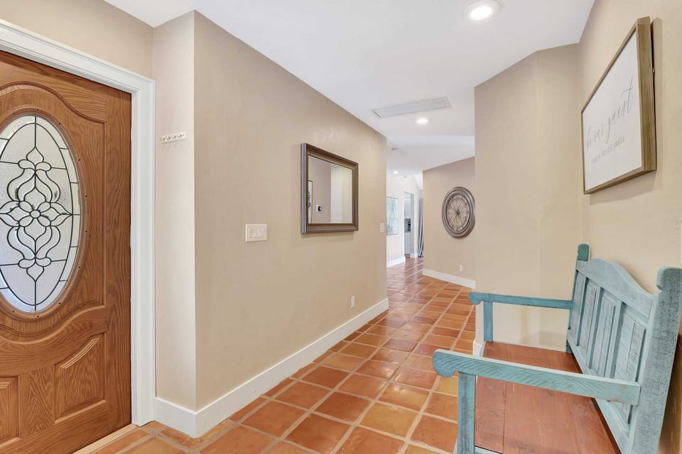 Unit 1 - The Front Door Opens Up to the Main Hallway Which Flows to the Kitchen and Family Room To the Right