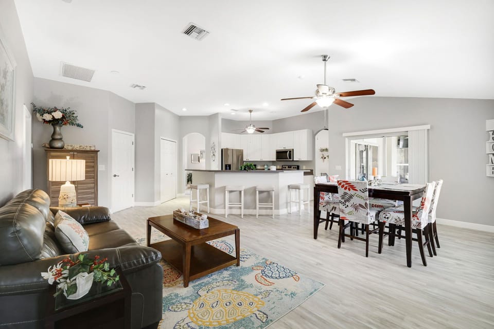 Open-concept kitchen, dining, and living area perfect for family gatherings.