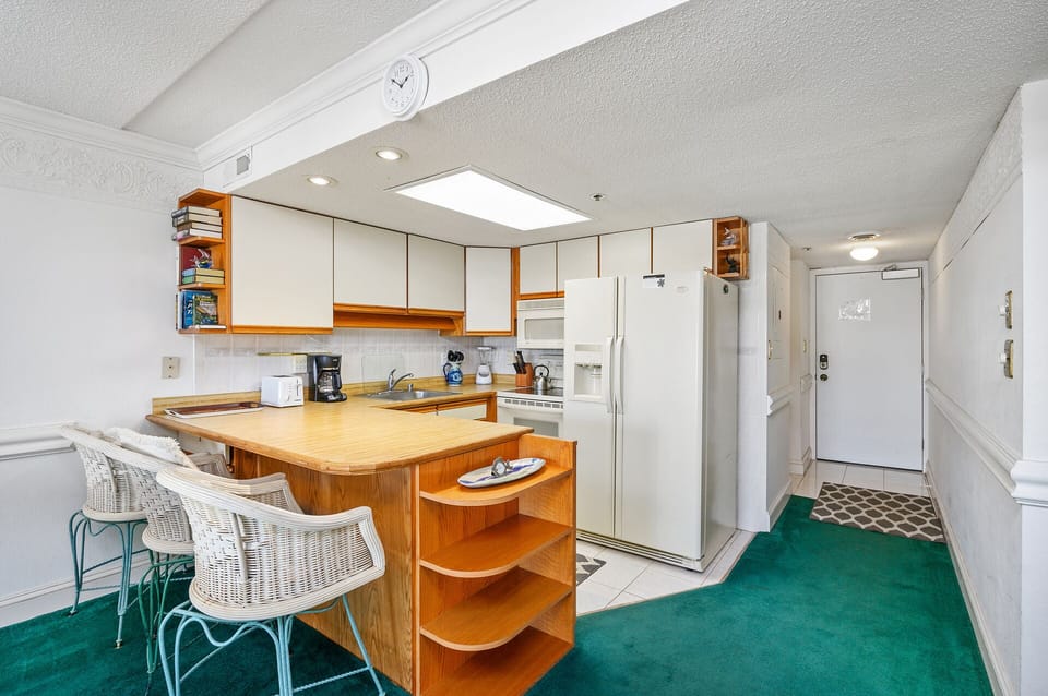Large Refrigerator you can fill by going to the grocery store so you can pack lunches for  your day at the beach, or just put your left overs in from your night out on the town.