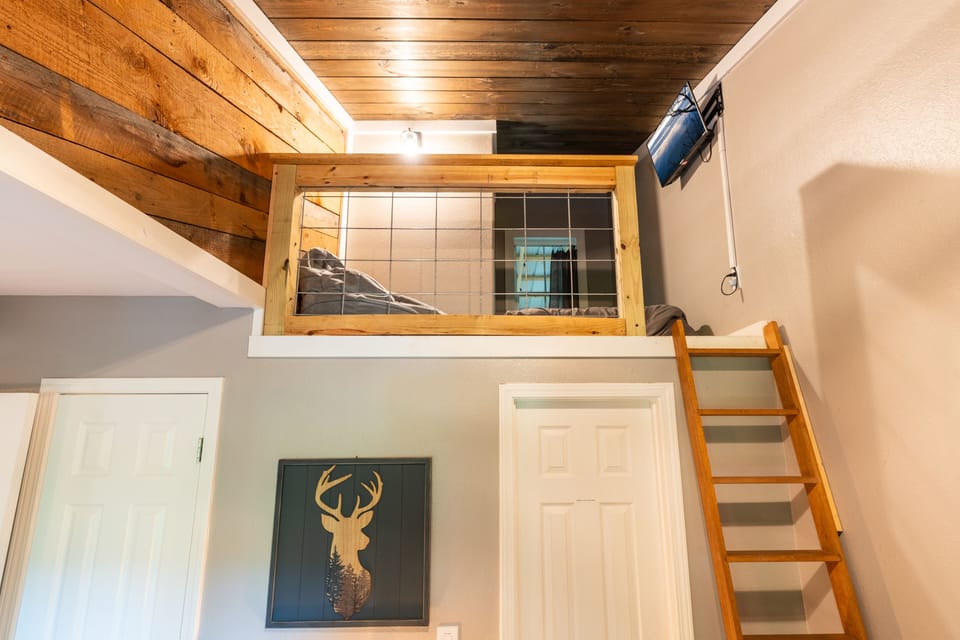 Loft area with Twin bed, bean bag chair, and Roku TV