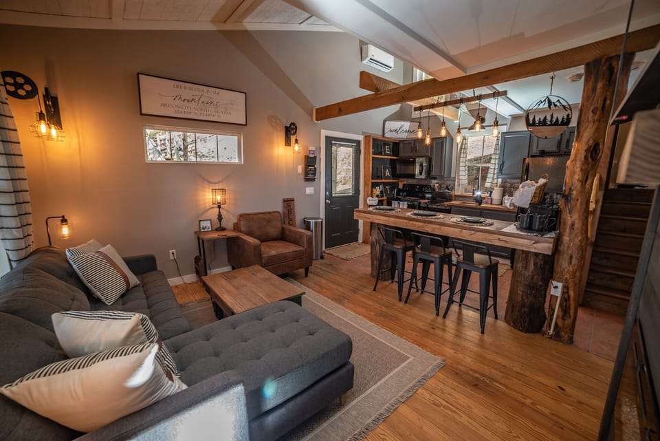 Beautiful Living and Kitchen area, with bar, and Roku TV.