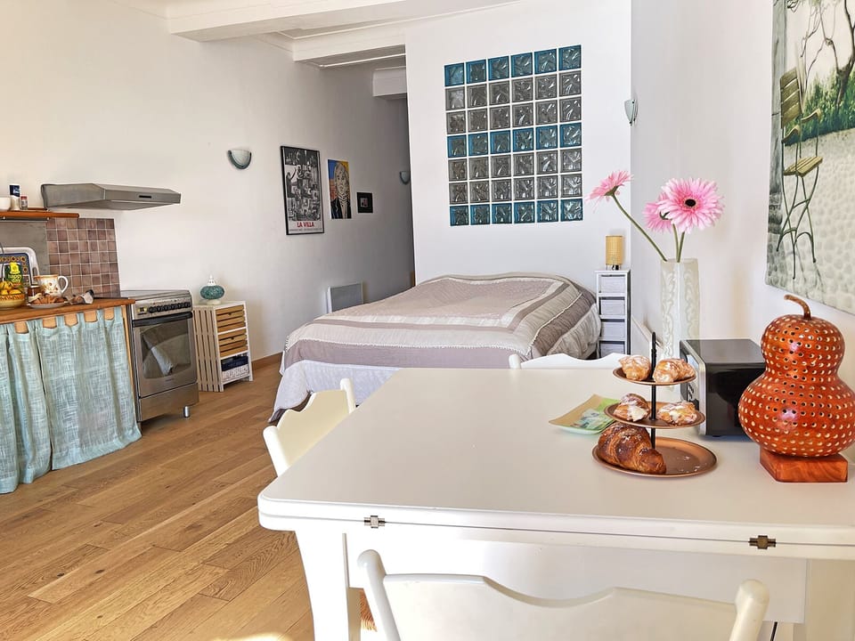 The room with the double bed and the kitchenette