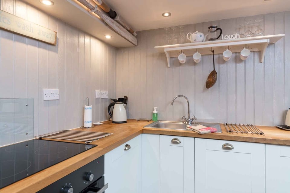 The bright fully fitted kitchen is perfect for a self catering getaway