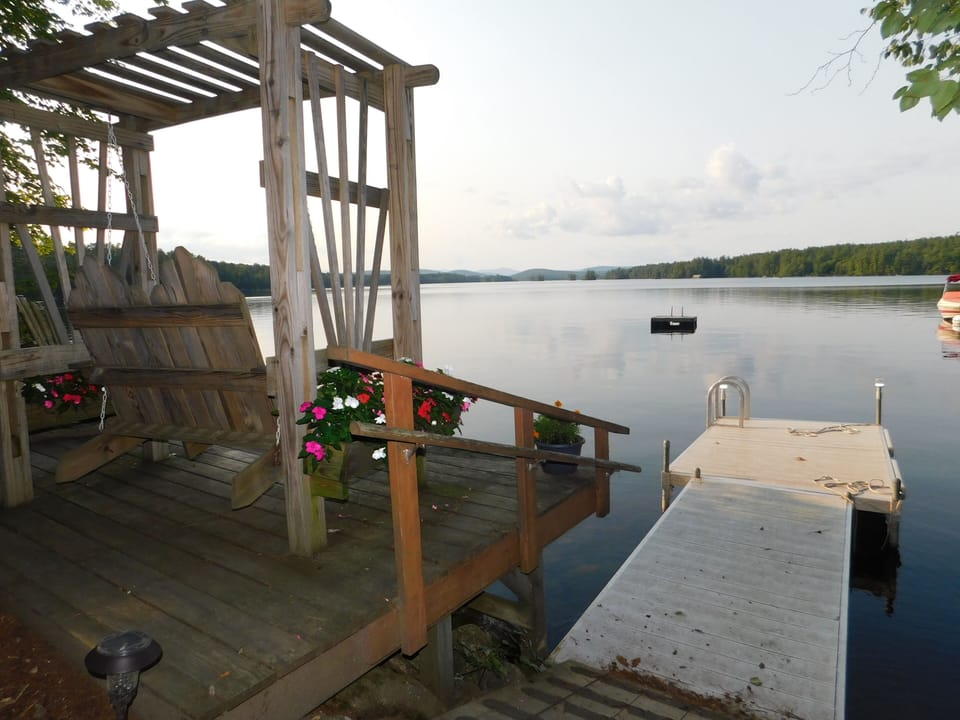 Wooden bench at waters edge