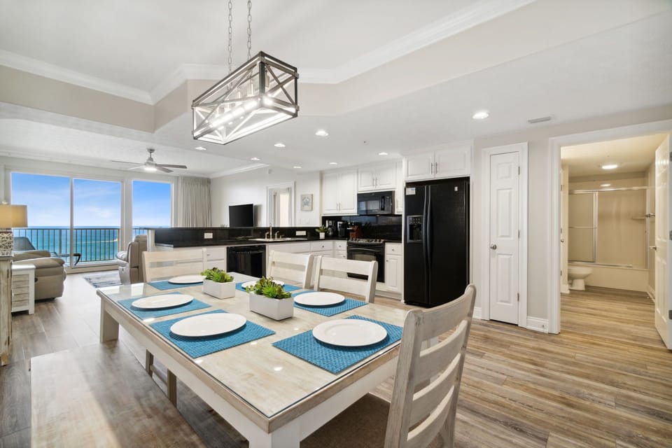 Open-concept kitchen and dining area with ocean views and modern finishes