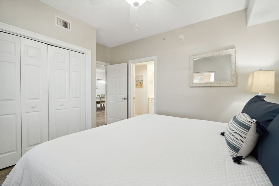 Bright bedroom with a large closet and neutral decor