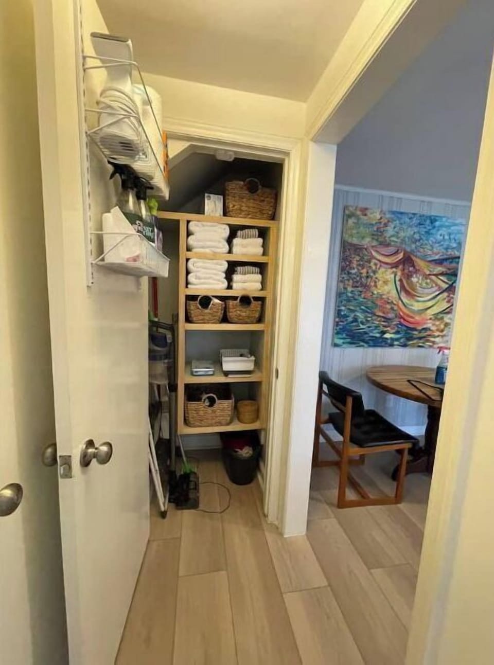 closet with cleaning supplies, extra towels, etc.