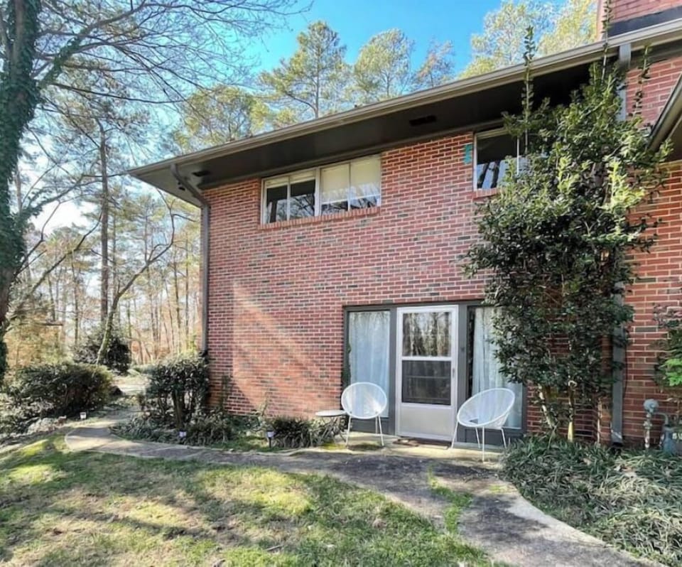 Outside entrance with patio furniture and small patio