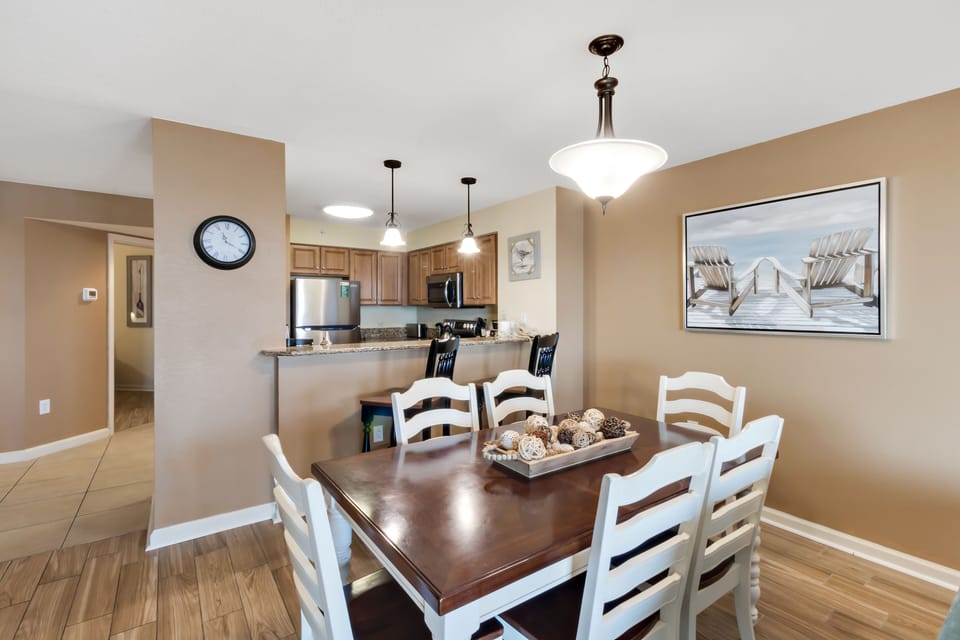 Gather around your spacious dining table for memorable meals, with a fully equipped kitchen ready for your culinary adventures.