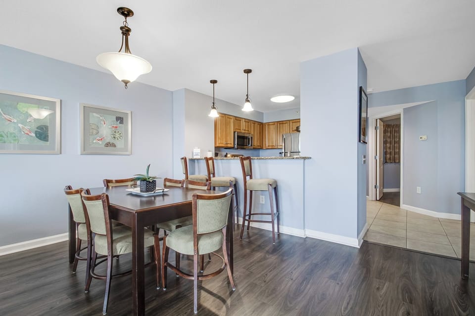 Gather around this elegant dining table for memorable meals with your loved ones in this spacious, light-filled area.