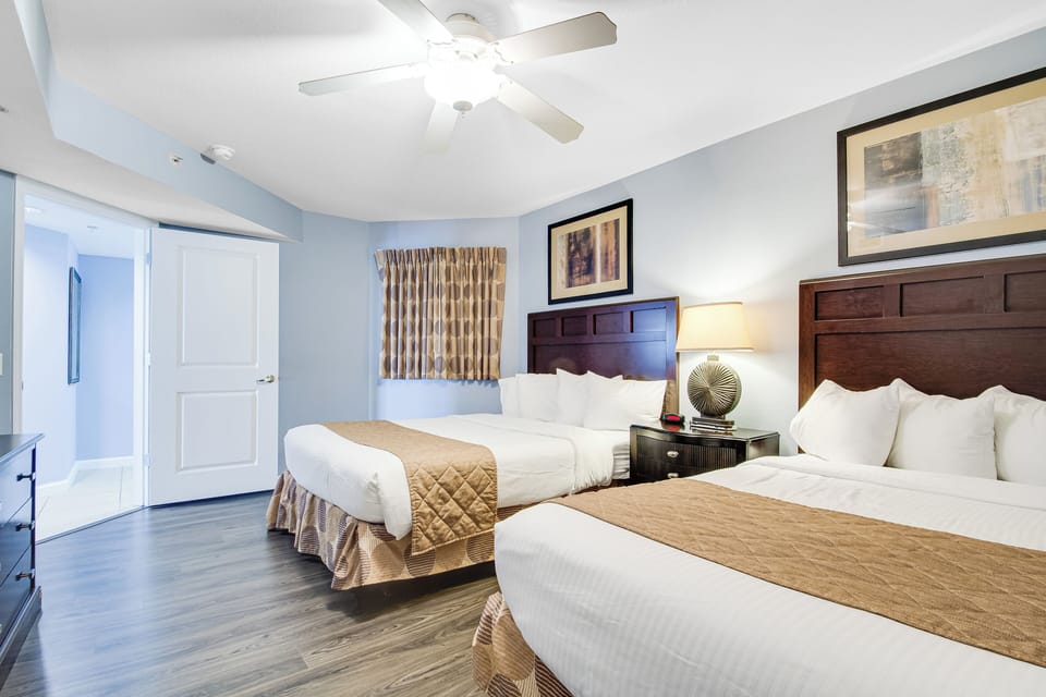 Unwind in your spacious twin bed sanctuary with plush linens, elegant furnishings, and soothing coastal colors that invite restful nights.