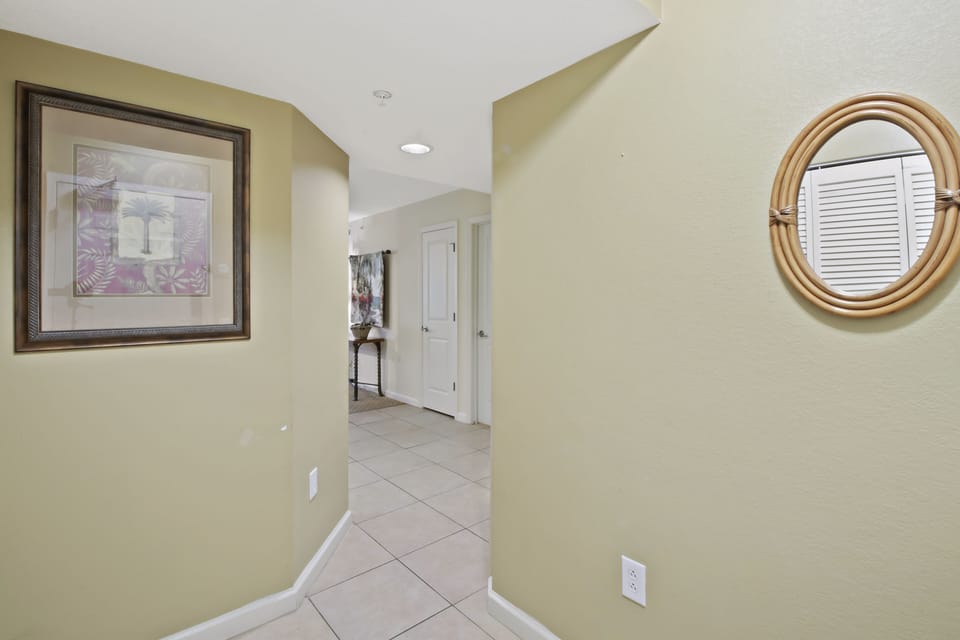 Step into your welcoming hallway with warm coastal tones and thoughtful artwork that creates an instantly relaxing atmosphere for your vacation retreat.