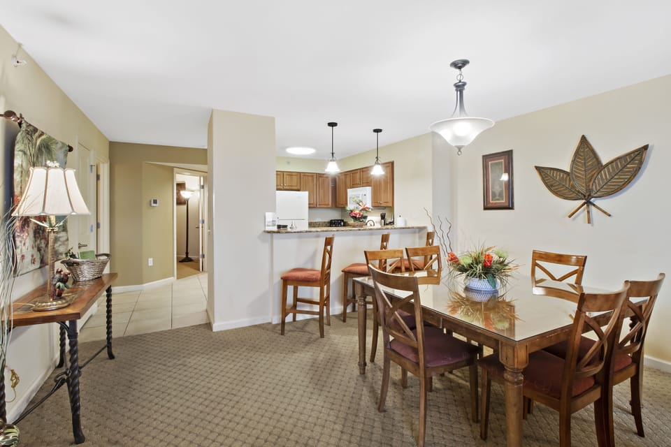 Gather around your elegant dining table where memorable meals and conversations await in this beautifully appointed space.