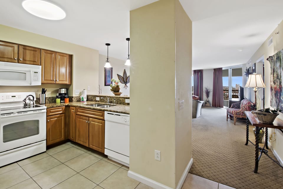 Your fully equipped kitchen flows seamlessly into the living area, perfect for preparing meals while staying connected with family and friends.