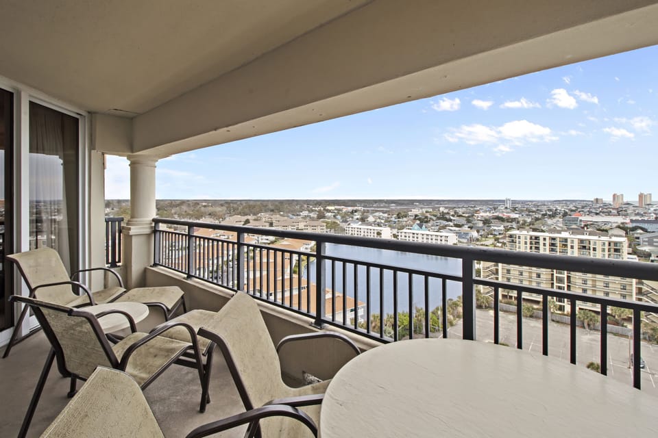 Step onto your private balcony and take in the sweeping city views stretching to the horizon while you relax in comfortable outdoor seating.