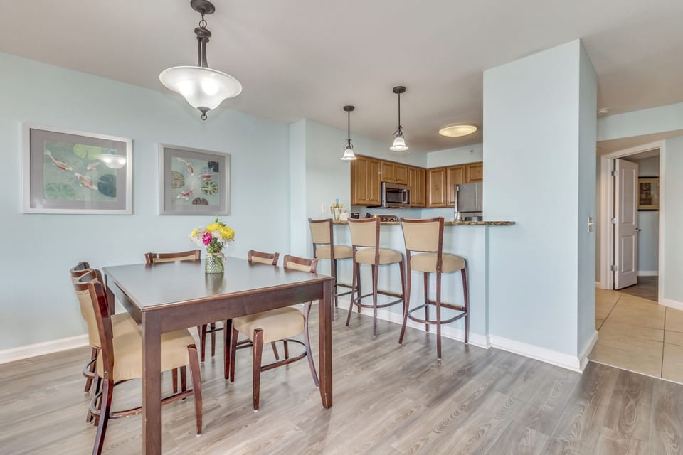 Your open-plan dining space flows seamlessly to the kitchen, creating perfect moments for shared meals and morning conversations.