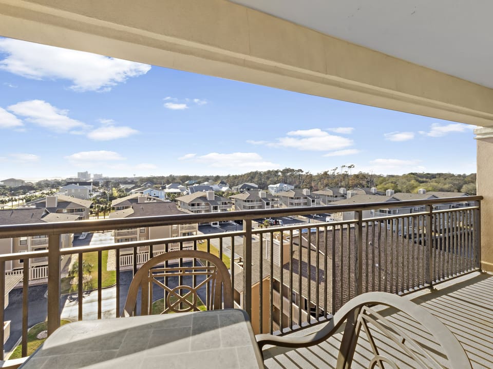 Unwind on your private balcony with sweeping neighborhood views stretching to the horizon under beautiful blue skies.