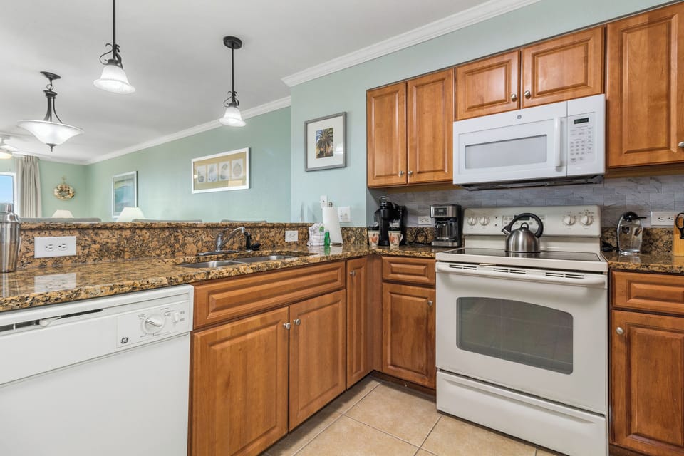 Your fully equipped kitchen features granite counters, warm wood cabinets, and all appliances needed for memorable meals together.