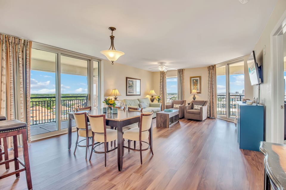 Your spacious living and dining area opens onto the balcony, where natural light fills the room and city views stretch beyond.