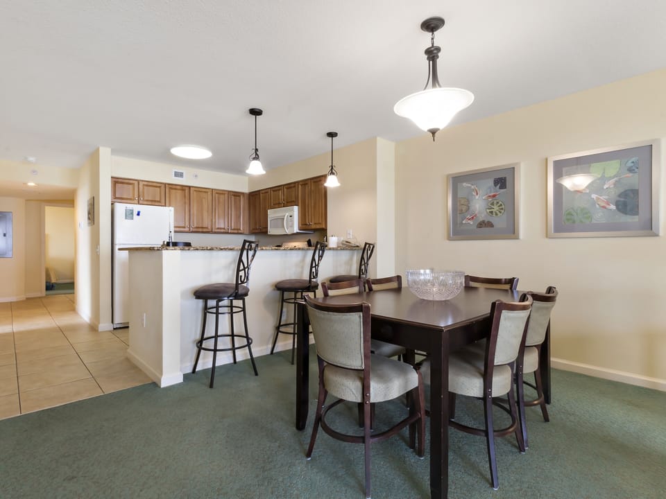 Your open-plan space flows seamlessly from the well-equipped kitchen to dining area, perfect for sharing meals and creating memories together.