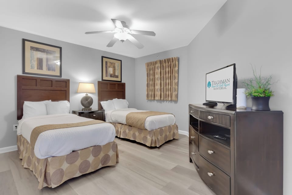Unwind in your cozy twin bedroom featuring premium linens, modern amenities, and thoughtful touches that make you feel right at home.