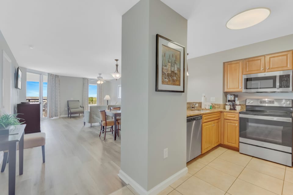 Your open-concept suite seamlessly blends kitchen, dining, and living spaces with ocean views and modern amenities for comfortable stays.