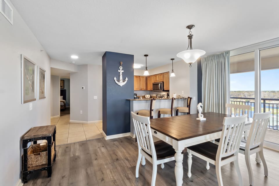 Gather around your spacious dining table for memorable meals with lake views streaming through floor-to-ceiling windows.