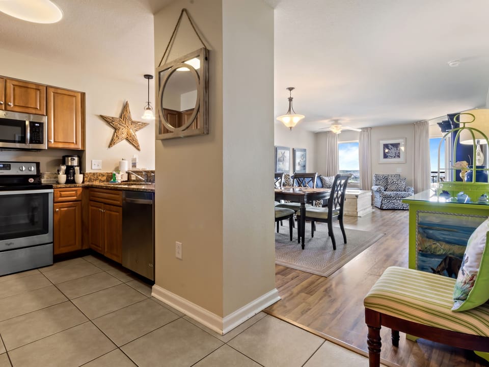 Relax in your open-concept retreat where the fully equipped kitchen flows into your cozy living and dining space, perfect for memorable meals together.